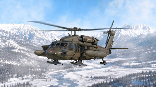 ICM artwork of a UH-60A Black Hawk with ESSS and skis over a snowy valley
