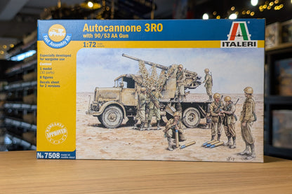 Model kit box for Autocannone 3RO with soldiers and truck on a wooden surface.