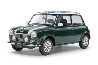 Green Mini Cooper with British flag on a white background