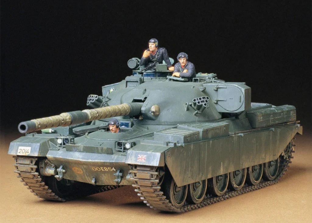 The Tamiya 1/35 Military - British Chieftain Mk.5 Tank (35068) model kit includes three uniformed figures (two in open hatches, one seated inside), a large main cannon, and detailed Cold War-era features.